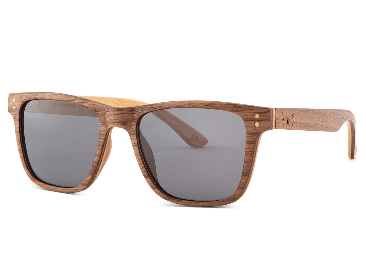 Madeira wooden sunglasses with dark lenses on a white background