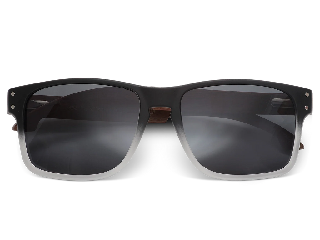 Black sunglasses with dark lenses on a white background