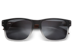 Black sunglasses with dark lenses on a white background