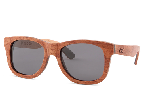 Wooden sunglasses with dark lenses on a white background