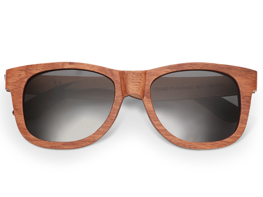 Wooden sunglasses with dark lenses on a white background