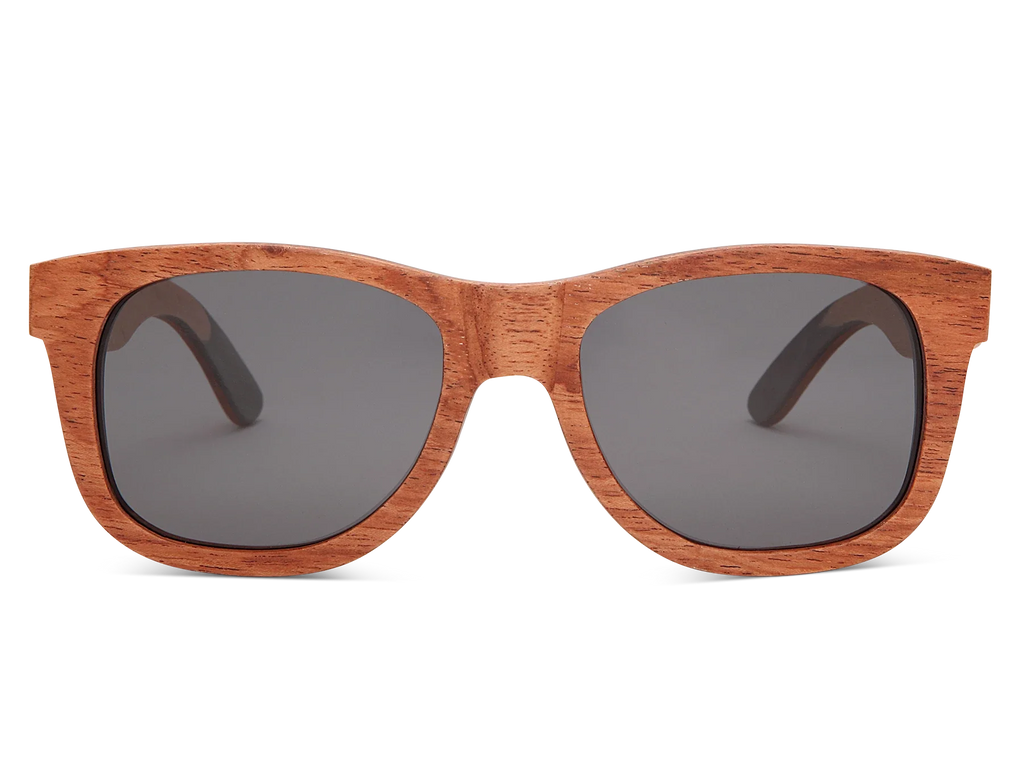 Wooden sunglasses with dark lenses on a white background