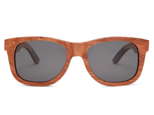 Wooden sunglasses with dark lenses on a white background