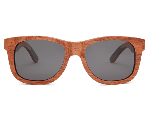 Wooden sunglasses with dark lenses on a white background
