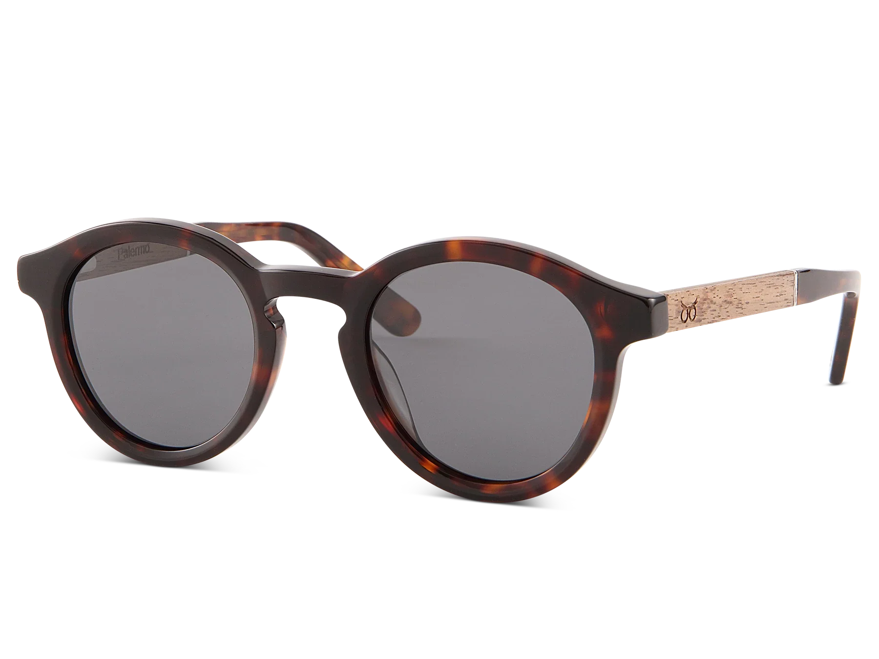 Sunglasses with tortoiseshell frame and dark lenses on a white background