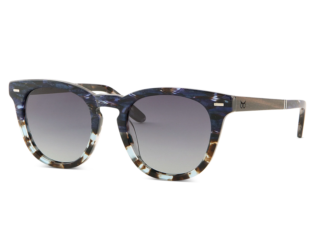 Sunglasses with tortoiseshell frame and dark lenses on a white background