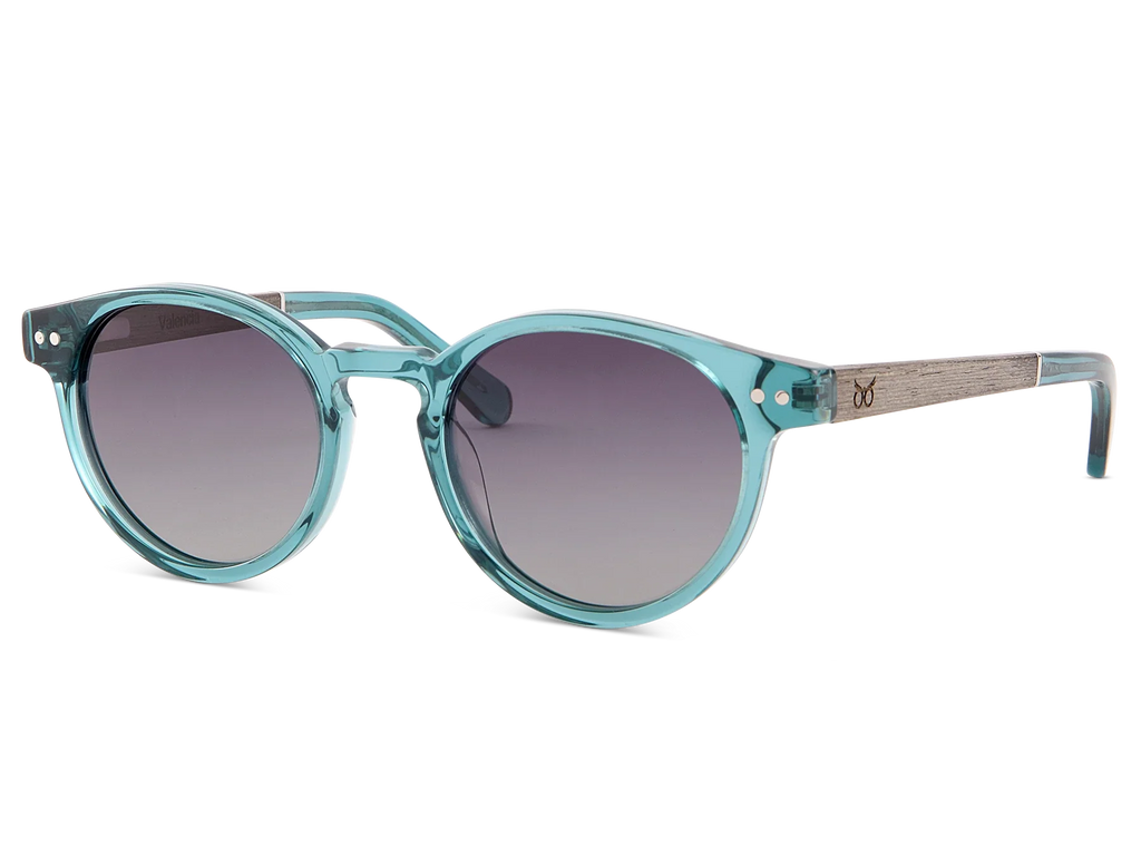 Teal sunglasses with a white background