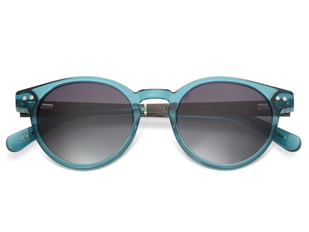 Teal sunglasses with dark lenses on a white background
